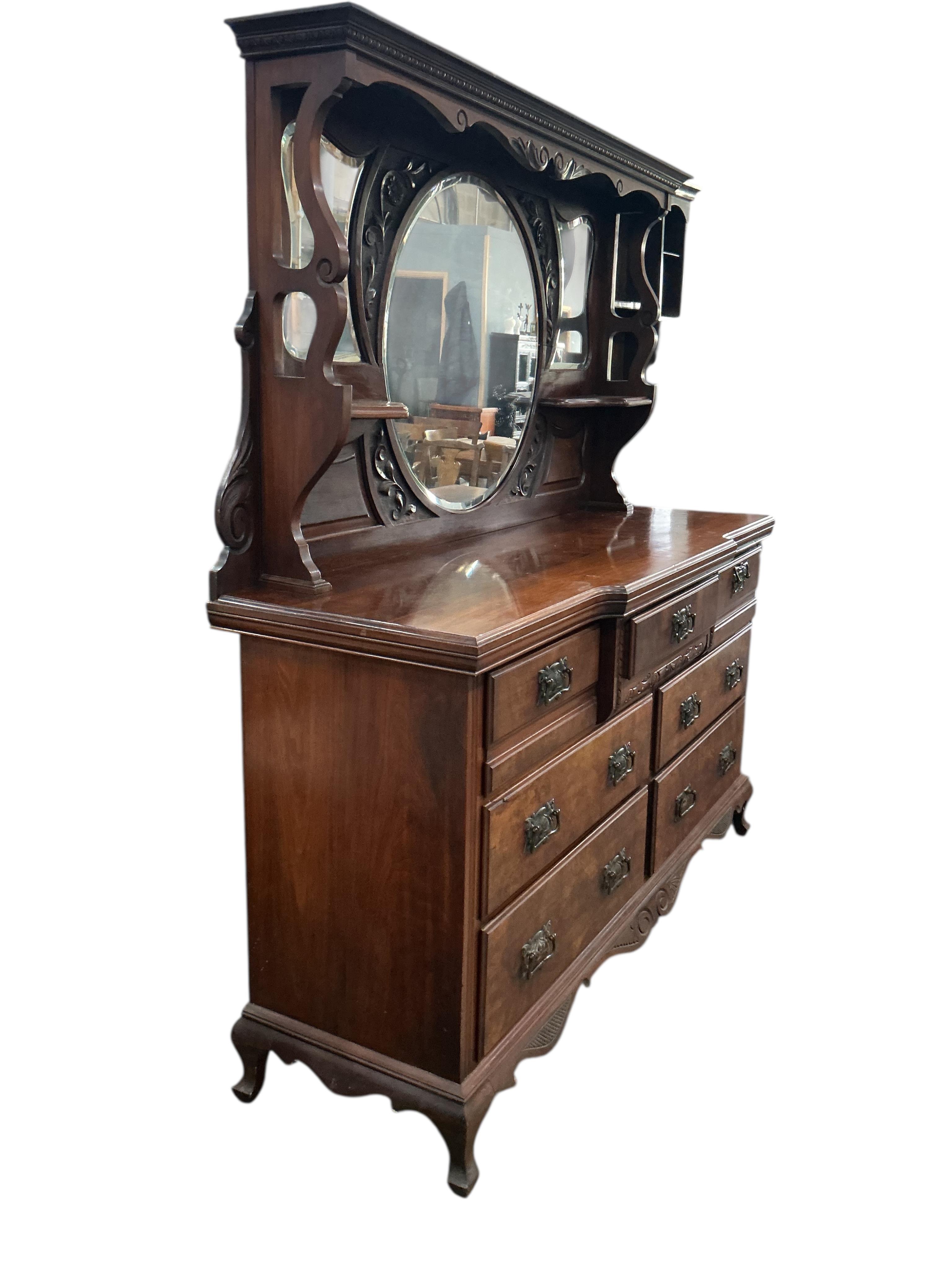 A late Victorian mirrored back walnut sideboard, width 170cm, depth 52cm, height 184cm